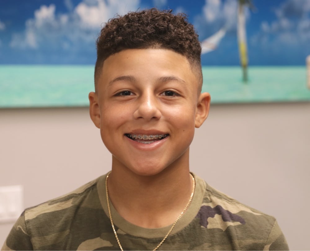 teen boy smiling with braces