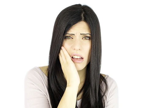 woman holding her jaw