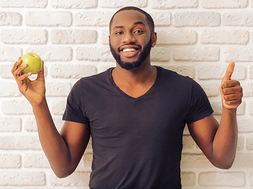 man holding an apple